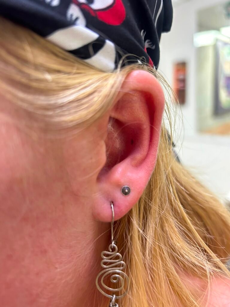 Cartilage ear piercing done at Tinta y Pinta Tattoo Quito