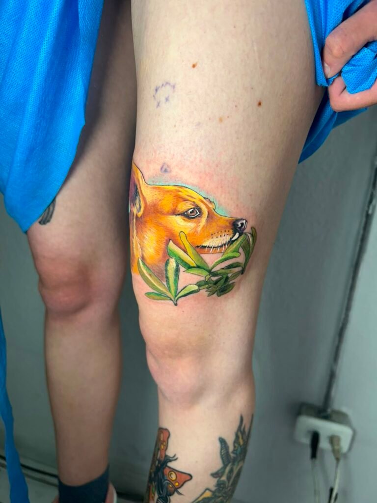 Realistic color dog portrait tattoo on leg done at Tinta y Pinta Tattoo Quito